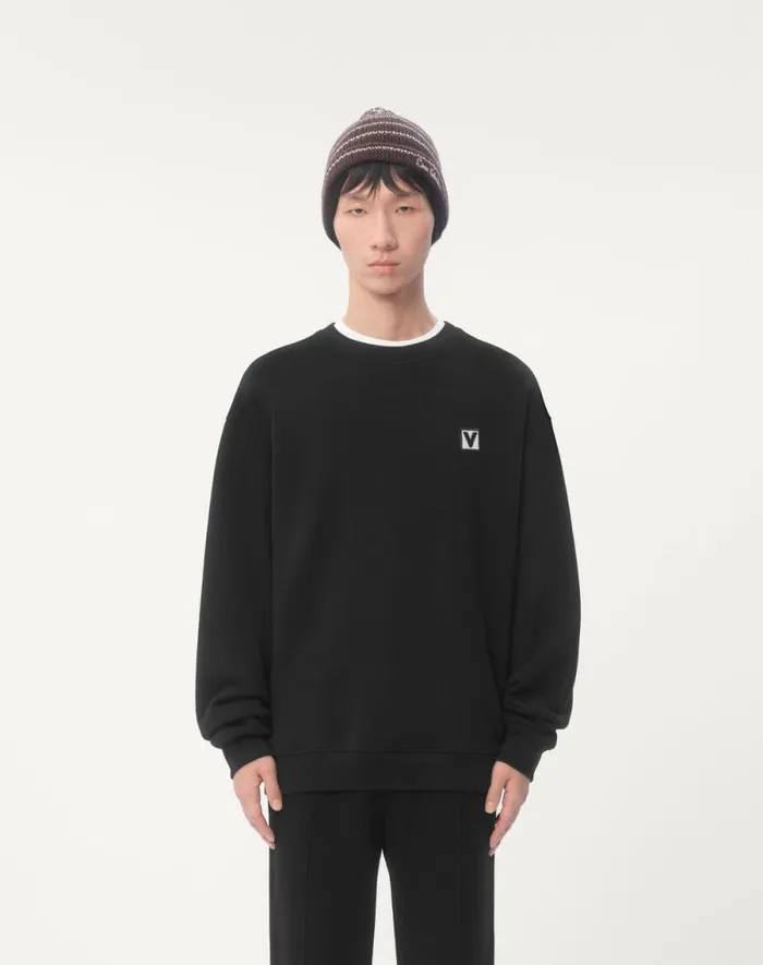 Valentino Tshirts And Sweatshirts Man Cotton Crewneck Sweatshirt With Chez Valentino Patch For Man In Black Black Valentino Tshirts And Sweatshirts Man Cotton Crewneck Sweatshirt With Chez Valentino Patch For Man In Black Black